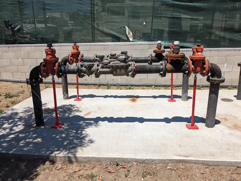 Above-ground backflow preventer assembly with brass test cocks and shut-off valves